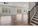 Spacious living room with beautiful hardwood floors, large windows, and access to an outdoor patio at 3330 Hillshire Dr, Cumming, GA 30028