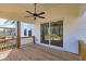 Spacious wooden deck with a ceiling fan, perfect for outdoor relaxation and entertaining with a view at 3330 Hillshire Dr, Cumming, GA 30028