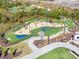 Beautifully manicured putting course with sand traps, water features, and professional lighting throughout at 3330 Hillshire Dr, Cumming, GA 30028