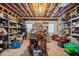 Unfinished basement is being used for storage with exposed ceiling and shelving at 4840 Brent Knoll Ln, Suwanee, GA 30024