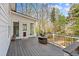 Spacious wooden deck with views of a lush backyard at 4840 Brent Knoll Ln, Suwanee, GA 30024