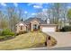 Beautiful brick house with lush landscaping, a driveway, and a mailbox at 4840 Brent Knoll Ln, Suwanee, GA 30024