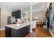 Modern kitchen with a large island, stainless steel appliances, and open floor plan at 4840 Brent Knoll Ln, Suwanee, GA 30024