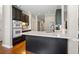 Well-equipped kitchen featuring dark cabinets, a white countertop, and modern appliances at 4840 Brent Knoll Ln, Suwanee, GA 30024