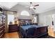 Comfortable bedroom with a vaulted ceiling, large bed, and ample natural light from windows at 4840 Brent Knoll Ln, Suwanee, GA 30024