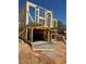 Framing view of a new home under construction including the foundation, basement, and wood support structure at 1236 Oakland Sw Ter # A, Atlanta, GA 30310