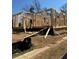 Framing view of a new home under construction showing the basic layout of the walls and window placement at 1236 Oakland Sw Ter # A, Atlanta, GA 30310
