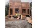 View of the new home under construction, focusing on the wood framing and window placement at 1236 Oakland Sw Ter # A, Atlanta, GA 30310