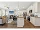 Open concept kitchen, dining, and living room is great for entertaining with an island and stainless appliances at 6355 Towhee Way, Morrow, GA 30260