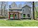 Backyard features a wooden pergola with seating, providing a relaxing outdoor space at 910 Brentwood Ave, Lawrenceville, GA 30044