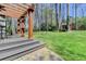 Wooden pergola with comfortable seating and lush lawn provides a serene outdoor retreat at 910 Brentwood Ave, Lawrenceville, GA 30044