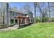 Backyard features a wooden pergola with seating and lush green grass at 910 Brentwood Ave, Lawrenceville, GA 30044