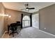 Home office with a modern chair, a large window, and a stylish floor lamp in a neutral color palette at 910 Brentwood Ave, Lawrenceville, GA 30044