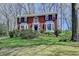 Charming two-story brick home with bay windows and a well-maintained landscaped front yard at 910 Brentwood Ave, Lawrenceville, GA 30044