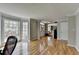 Open foyer with hardwood floors, a large bay window, and access to various rooms in the house at 910 Brentwood Ave, Lawrenceville, GA 30044
