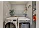 Well-organized laundry area with modern LG washer and dryer and ample storage shelving at 910 Brentwood Ave, Lawrenceville, GA 30044