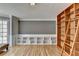 Bright living room with hardwood floors, built-in shelves, and a cozy window seat for relaxing at 910 Brentwood Ave, Lawrenceville, GA 30044