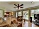 Inviting living room with hardwood floors offering views of both the kitchen and a relaxing outdoor space at 910 Brentwood Ave, Lawrenceville, GA 30044