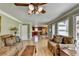 Bright living room with hardwood floors leading to a view of the kitchen and an outdoor patio at 910 Brentwood Ave, Lawrenceville, GA 30044