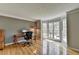 Home office features hardwood floors and a bay window, creating a bright and inviting workspace at 910 Brentwood Ave, Lawrenceville, GA 30044