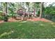 Well-maintained backyard with lush lawn and mature trees, creating a serene and private setting at 1309 Brookshire Ne Ln, Brookhaven, GA 30319