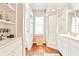 Bathroom featuring a glass shower, storage, and hardwood floors at 1309 Brookshire Ne Ln, Brookhaven, GA 30319