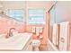 Bathroom featuring a sink, toilet, bathtub and shower combo, and towel rack at 1309 Brookshire Ne Ln, Brookhaven, GA 30319