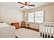 Bedroom featuring a crib, area rug, neutral colors, and natural light at 1309 Brookshire Ne Ln, Brookhaven, GA 30319