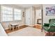 Bedroom featuring hardwood floors, area rug, table, and natural light at 1309 Brookshire Ne Ln, Brookhaven, GA 30319