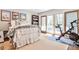 Bedroom with a peloton, bed, posters, bookshelf, and patio access at 1309 Brookshire Ne Ln, Brookhaven, GA 30319