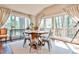 Bright dining area with a wooden table and views to the deck at 1309 Brookshire Ne Ln, Brookhaven, GA 30319