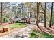 Charming home nestled among mature trees with a well-manicured front yard, and welcoming curb appeal at 1309 Brookshire Ne Ln, Brookhaven, GA 30319