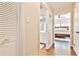 Bright hallway showcasing hardwood floors, closet space, and views into the bathroom and bedroom at 1309 Brookshire Ne Ln, Brookhaven, GA 30319
