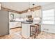 The remodeled kitchen boasts an island, breakfast bar, stainless appliances, and brick accents at 1309 Brookshire Ne Ln, Brookhaven, GA 30319