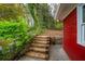 Backyard access with wooden stairs and landscaped area at 1323 Christmas Ne Ln, Atlanta, GA 30329
