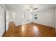 Bright bedroom features wood floors, white walls, a ceiling fan, and two doorways at 1323 Christmas Ne Ln, Atlanta, GA 30329