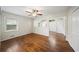 Bedroom with hardwood floors, white walls, a ceiling fan, and two windows at 1323 Christmas Ne Ln, Atlanta, GA 30329