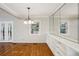 Dining room with hardwood floors, modern lighting, and access to an outside patio at 1323 Christmas Ne Ln, Atlanta, GA 30329