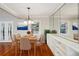 Dining room features hardwood flooring, a modern chandelier, and seamless access to the outdoors at 1323 Christmas Ne Ln, Atlanta, GA 30329
