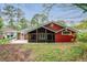 View of home's back exterior featuring a screened porch and patio at 1323 Christmas Ne Ln, Atlanta, GA 30329