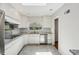 Bright kitchen featuring white cabinets, stainless steel appliances, and a window above the sink at 1323 Christmas Ne Ln, Atlanta, GA 30329