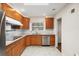 Stylish kitchen with stainless steel appliances, granite countertops, and natural wood cabinets, perfect for cooking at 1323 Christmas Ne Ln, Atlanta, GA 30329