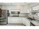 Kitchen featuring stainless steel appliances, granite countertops, and lots of counter space at 1323 Christmas Ne Ln, Atlanta, GA 30329