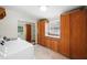 Bright laundry room with tile floor, large storage cabinets, washer and dryer at 1323 Christmas Ne Ln, Atlanta, GA 30329