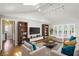 Bright living room with vaulted ceilings, hardwood floors, and French doors leading to the outside at 1323 Christmas Ne Ln, Atlanta, GA 30329