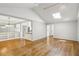Spacious living room featuring hardwood floors, vaulted ceiling, and an open layout to the kitchen at 1323 Christmas Ne Ln, Atlanta, GA 30329
