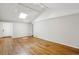 Open-concept living area with hardwood floors, vaulted ceiling and natural light at 1323 Christmas Ne Ln, Atlanta, GA 30329