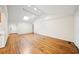 Bright living room featuring hardwood floors, vaulted ceiling, and a skylight, offering a modern and airy ambiance at 1323 Christmas Ne Ln, Atlanta, GA 30329