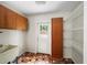 Mud room with tile floors, overhead cabinets, access to backyard at 1323 Christmas Ne Ln, Atlanta, GA 30329