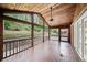 Large screened in porch with wood ceiling, brick floor, and view of the backyard at 1323 Christmas Ne Ln, Atlanta, GA 30329